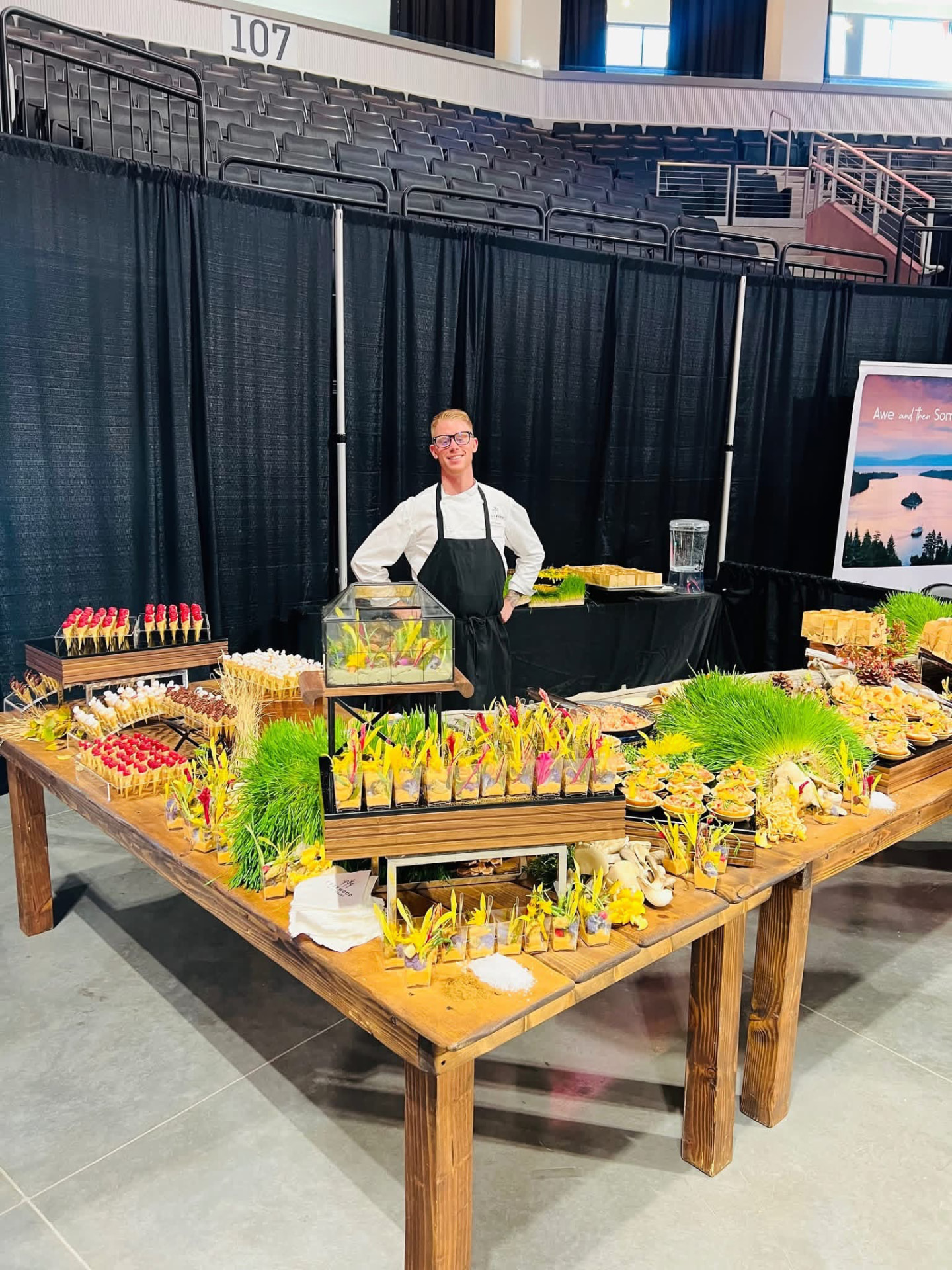 Chef Ethan behind a large-scale canapé and passed-bite display